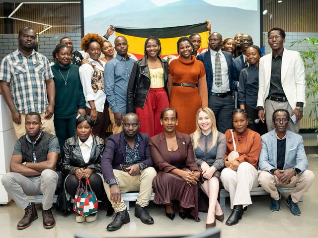 Group photograph of participants at the Uganda National Day celebration in Warsaw